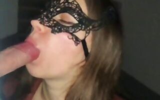 Hot teen wearing a mask and she is blowing dick